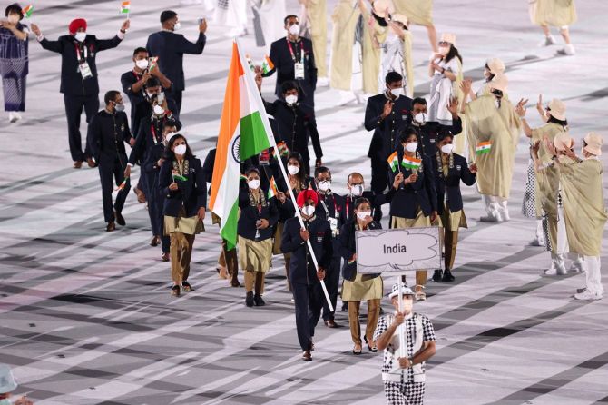 Flagbearers M C Mary Kom and Manpreet Singh lead Team India out during the Opening Ceremony
