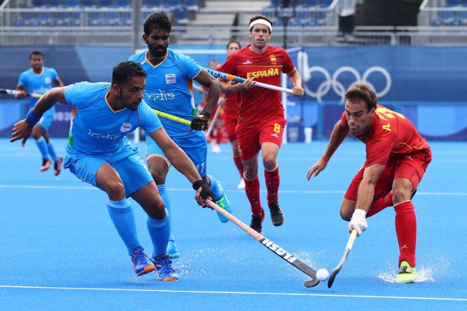 India's Harmanpreet Singh battles for possession with Alejandro Alonso.