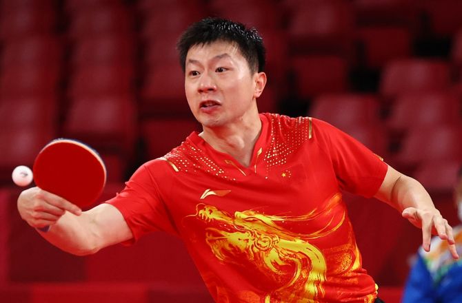China's Ma Long in action during his men's singles Round 3 match against Sharath Kamal 