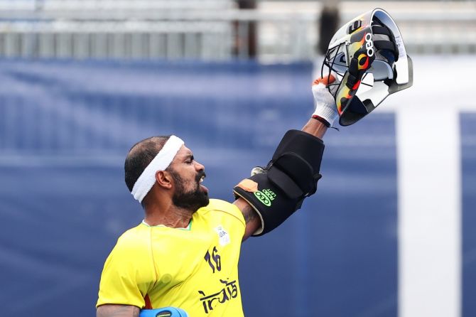 India's goalkeeper Sreejesh reacts after foiling a Spanish attempt at goal. 