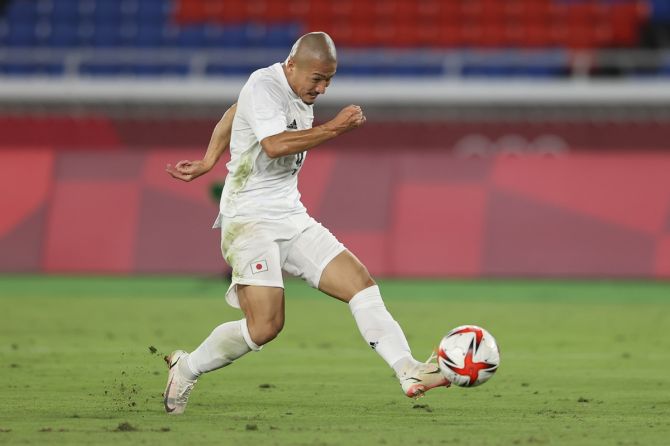 Daizen Maeda (No. 9) scores Japan's fourth goal against France