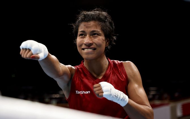 India's Lovlina Borgohain (Red) celebrates victory over Chinese Taipei's Nien Chin Chen after the Olympics women's Welterweight (64-69kg) quarter-final bout, at Kokugikan Arena in Tokyo, on Friday. 