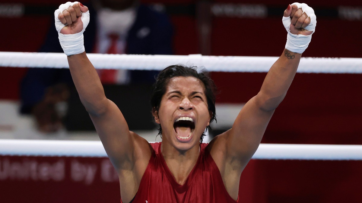 India's Lovlina Borgohain (Red) celebrates victory over Chinese Taipei's Nien Chin Chen after the Olympics women's Welterweight (64-69kg) quarter-final, at Kokugikan Arena in Tokyo, on Friday.
