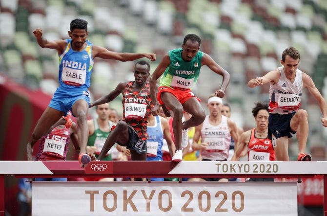 India's Avinash Sable, Ethiopia's Getnet Wale, Kenya's Abraham Kibiwott and Britain's Zak Seddon in action during Heat 2 of the Olympics men's 3000m Steeplechase, at Olympic Stadium in Tokyo, on Friday.