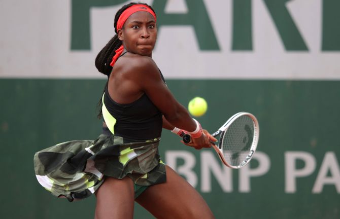 Coco Gauff of the United States plays a backhand during her women's second round match against Qiang Wang of China