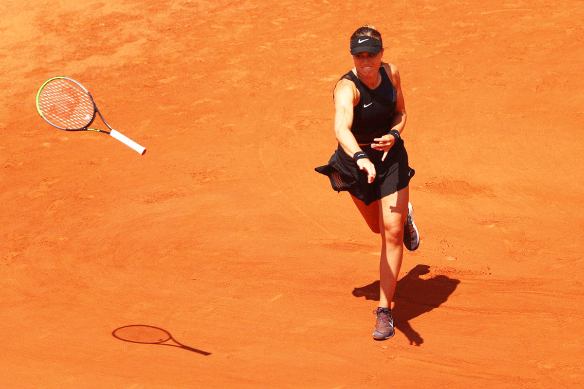 Spain's Paula Badosa throws her racket in frustration