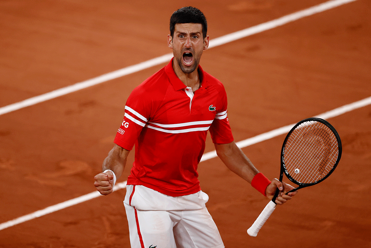 Serbia's Novak Djokovic celebrates winning his quarter-final match against Italy's Matteo Berrettini to become only the second man to reach 40 Grand Slam semi-finals after Roger Federer. 