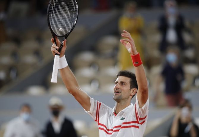 Serbia's Novak Djokovic celebrates victory over Spain's Rafael Nadal in the semi-finals of the French Open, in Paris