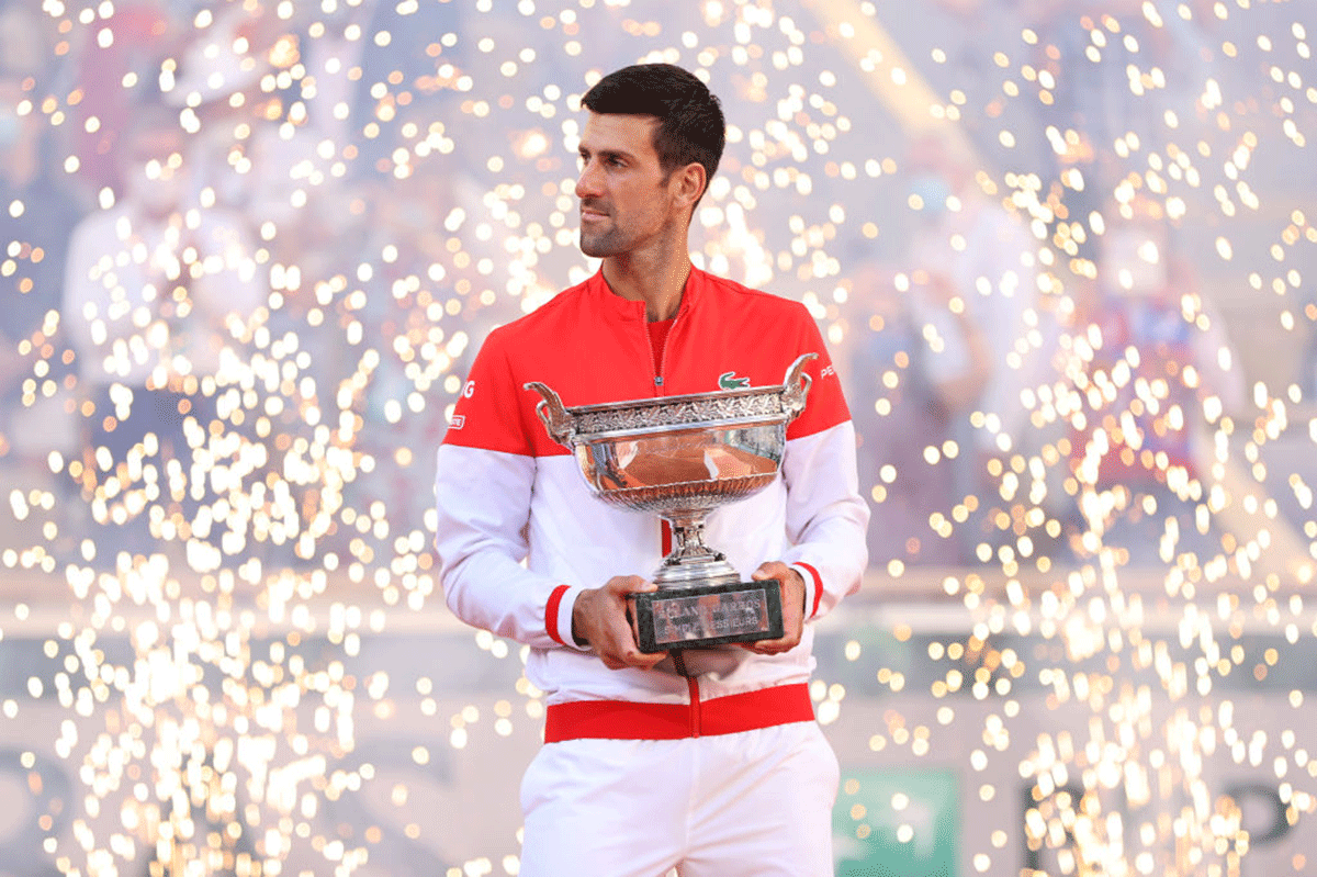 Novak Djokovic celebrates as he holds the trophy after winning the French Open title on Sunday. Djokovic had won Wimbledon in 2019 and will be the favourite to add a sixth title on the grass, after which he will turn his thoughts to the Olympic Games and the US Open.