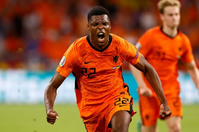 Denzel Dumfries celebrates after scoring the Netherlands's third goal during the Euro 2020 Group C match against Ukraine