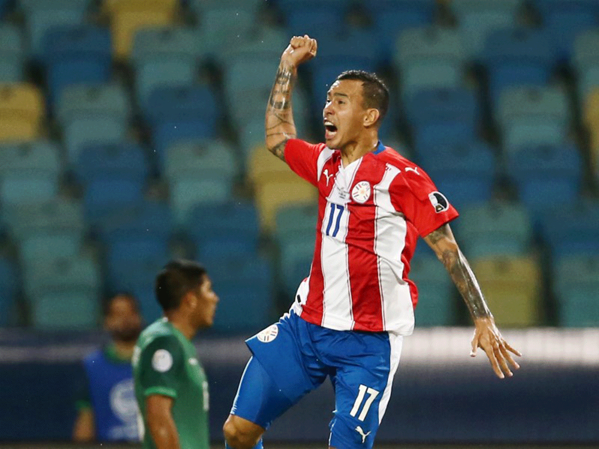 Paraguay's Kaku celebrates scoring their first goal against Bolivia during their Group A match 