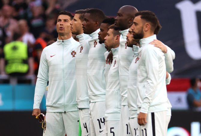 Cristianao Ronaldo lines up with the Portugal team for the national anthem prior to the Euro 2020 Group F match against Hungary, at Puskas Arena in Budapest, on Tuesday. 