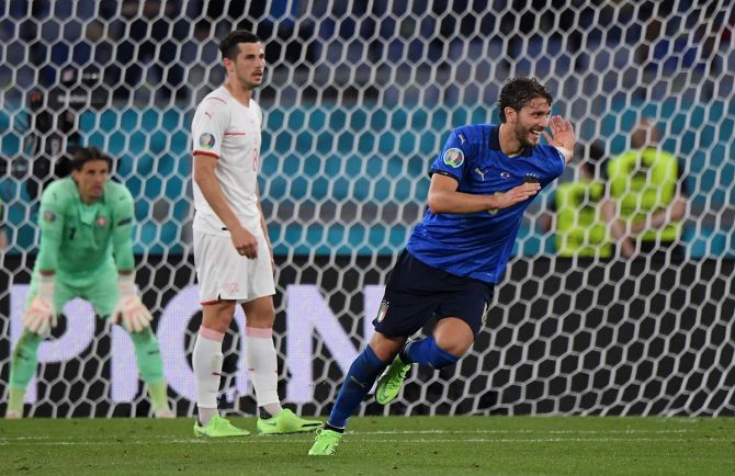 Manuel Locatelli celebrates scoring Italy's second goal.