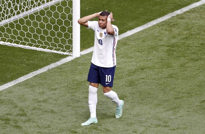 France's Kylian Mbappe reacts after missing a chance to score