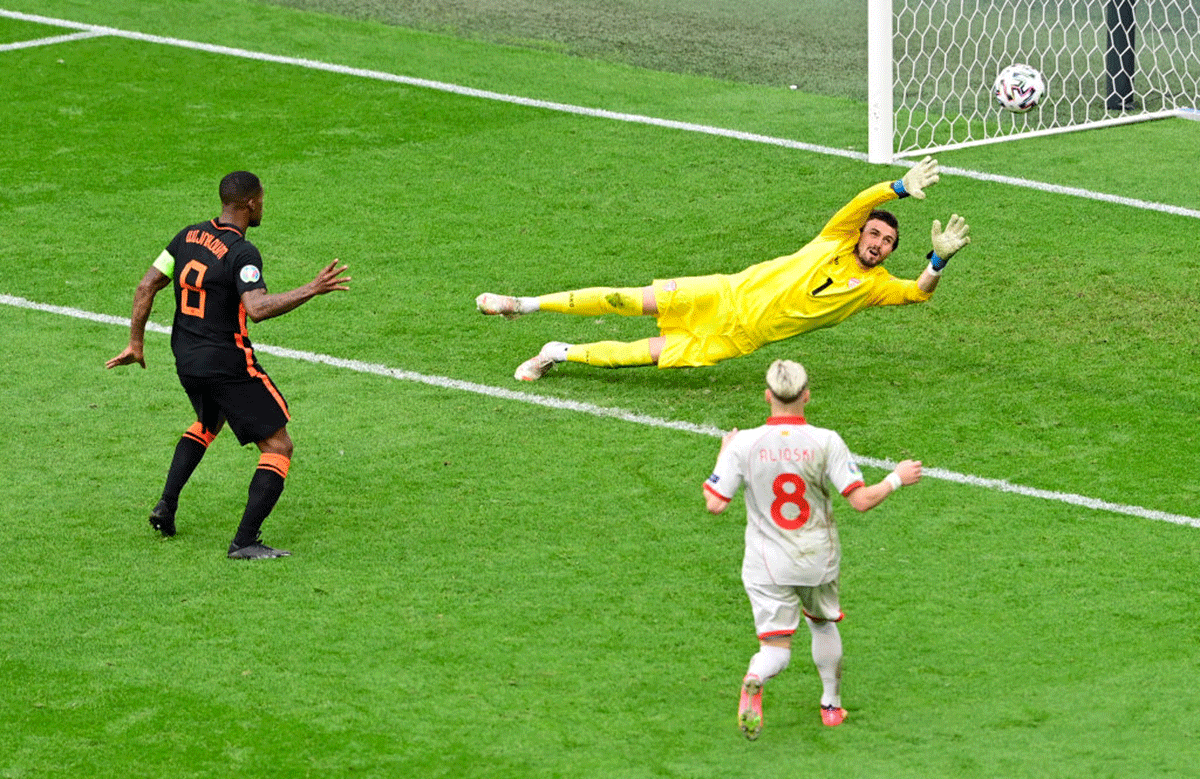  Netherlands' Georginio Wijnaldum nets the third goal past North Macedonia keeper Stole Dimitrievski