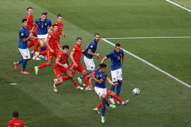 Matteo Pessina connects a cross into goal to put Italy ahead during the Euro 2020 Group A match against Wales, at Olimpico stadium in Rome, on Sunday. 