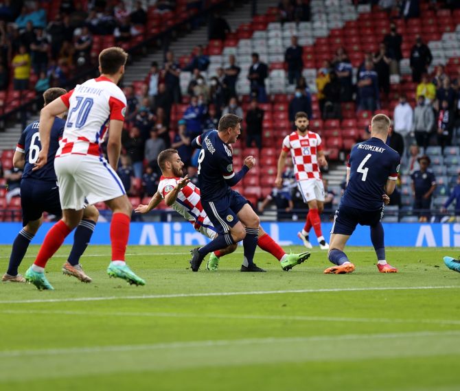 Nikola Vlasic scores Croatia's first goal whilst under pressure from Scotland's Callum McGregor 
