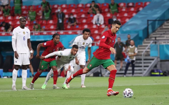 Cristiano Ronaldo steps up to score from the penalty spot and put Portugal ahead during the Euro 2020 Group F match against France, at Puskas Arena in Budapest, Hungary, on Wednesday.