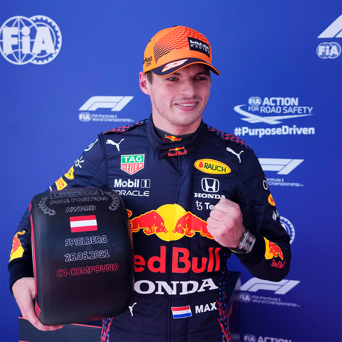 Max Verstappen celebrates on the podium after finishing taking pole position at the Styrian Grand Prix qualifying on Saturday