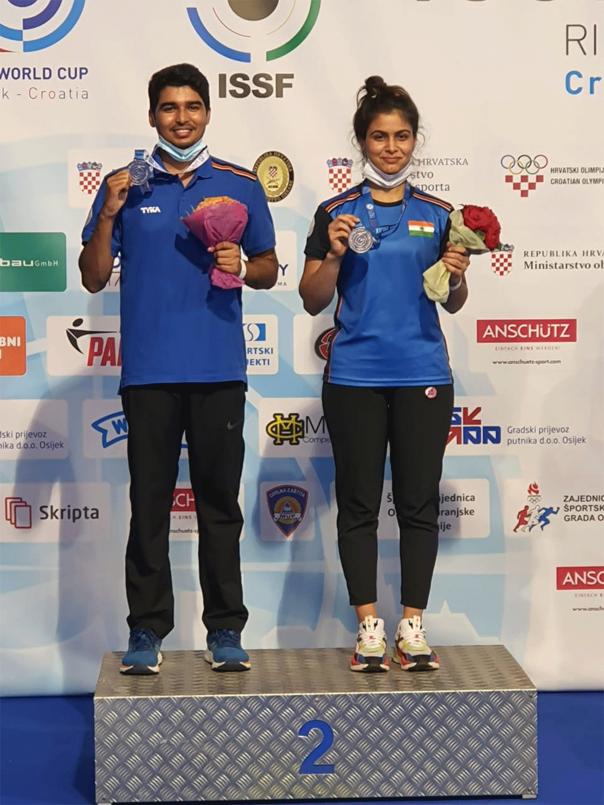 Saurabh Chaudhary and Manu Bhaker on the podium on winning the 10m air pistol mixed team event 