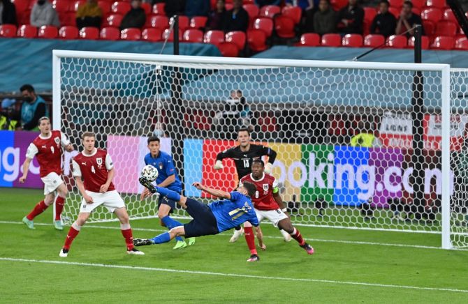 Italy's Domenico Berardi attempts an overhead kick