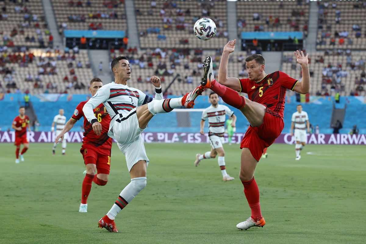 Portugal's Cristiano Ronaldo battles for possession with Belgium's Jan Vertonghen