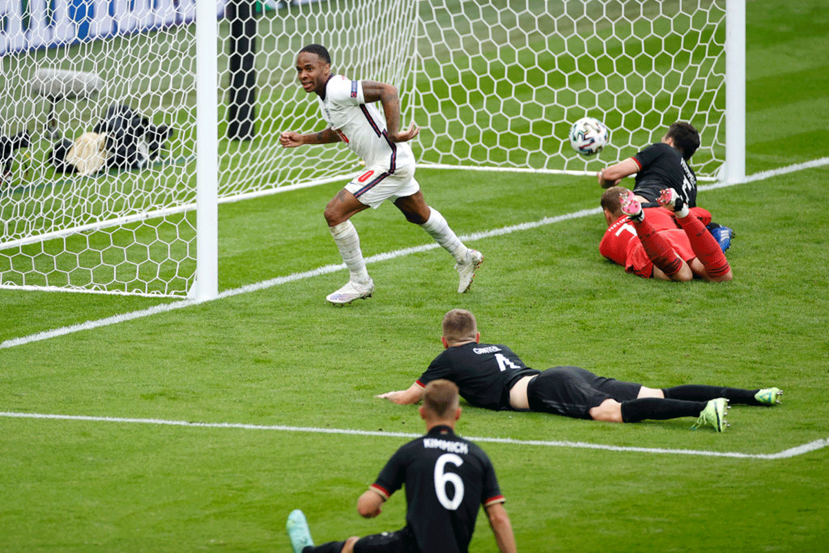 England's Raheem Sterling celebrates after scoring their first goal