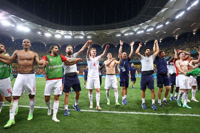 Switzerland's players celebrate victory over France in the penalty shoot-out after the Euro 2020 Round of 16 match, at National Arena in Bucharest, Romania, on Monday. 