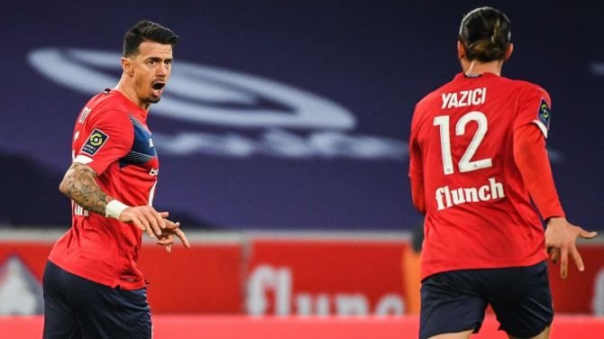 Lille's Jose Fonte (left) celebrates on scoring