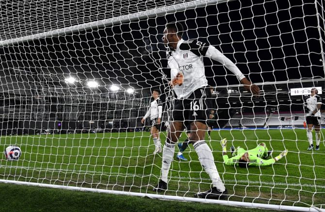 Fulham's Tosin Adarabioyo reacts after scoring an own goal during Thursday's Premier League match against Tottenham Hotspur.