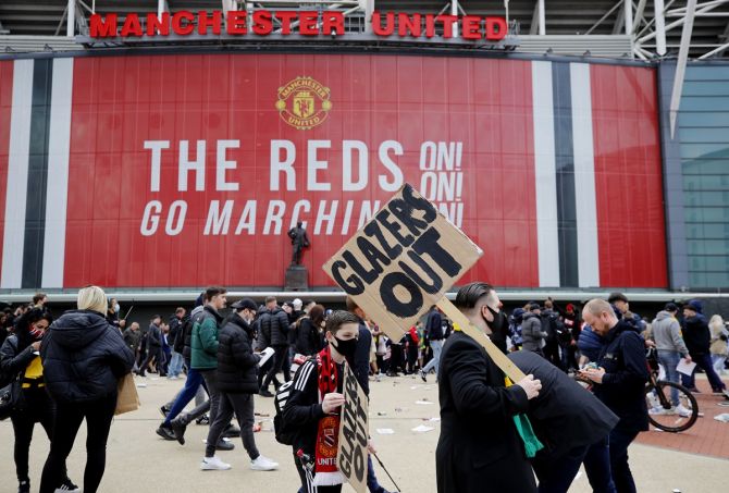 Manchester United fans protest against the team owners before the Premier League match against Liverpool on Sunday. 