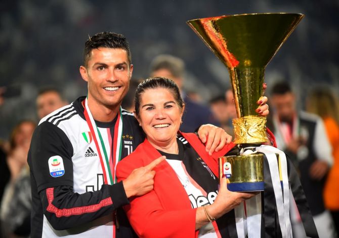 Juventus' Cristiano Ronaldo poses with his mother Maria Dolores dos Santos Aveiro as he celebrates winning Serie A title in 2019 