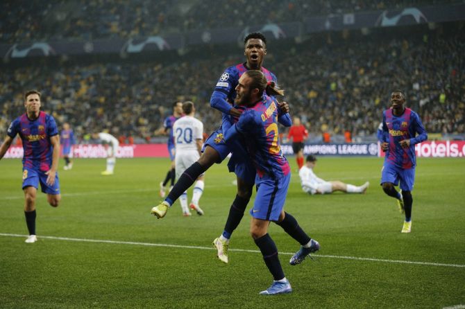 Ansu Fati celebrates with Oscar Mingueza after scoring for FC Barcelona during the Champions League Group E match against Dynamo Kyiv, at NSC Olympiyskiy, in Kyiv, Ukraine.