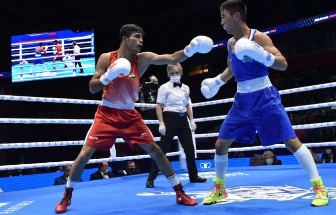 India’s Akash Kumar in action during the 54kg semi-final bout against Kazakhstan’s Makhmud Sabyrkhan at the World Boxing Championships, in Belgrade, on Thursday.