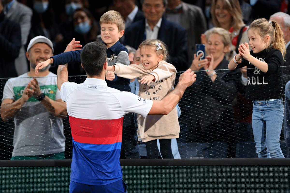 Serbia's Novak Djokovic celebrates with his family after winning the Paris Masters final against Russia's Daniil Medvedev at AccorHotels Arena in Paris on Sunday