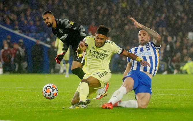 Arsenal's Pierre-Emerick Aubameyang is thwarted by Brighton & Hove Albion's Shane Duffy and Robert Sanchez.
