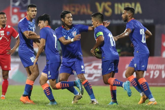 Anirudh Thapa, No. 7, celebrates with teammates after restoring parity for India in the international friendly against Nepal, in Kathmandu, on Thursday.