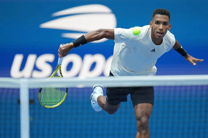 Felix Auger-Aliassime hits a volley during his semi-final against Daniil Medvedev.