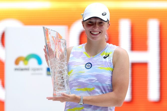 Poland's Iga Swiatek poses with the Butch Buchholz trophy after defeating Japan's Naomi Osaka in the women's final of the Miami Open at Hard Rock Stadium in Miami Gardens, Florida, on Saturday.