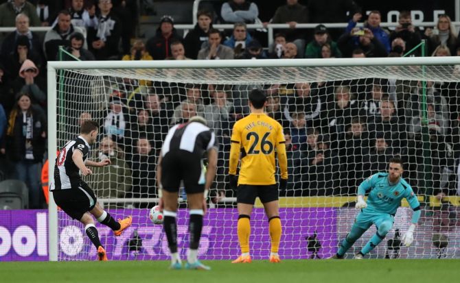 Newcastle United's Chris Wood scores from the penalty spot during the Premier League match against Wolverhampton Wanderers, at St James' Park, Newcastle, on Friday.