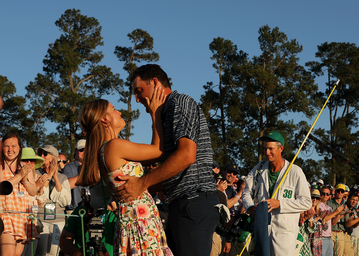 Scottie Scheffler celebrates with his wife Meredith Scudder after winning The Masters
