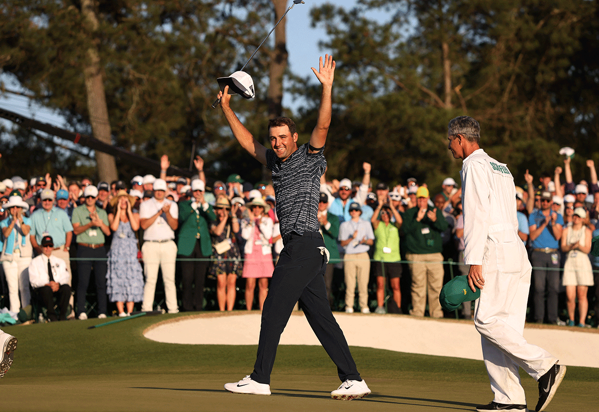 Scottie Scheffler celebrates on the 18th green after winning The Masters 