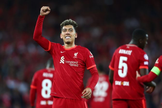 Roberto Firmino celebrates scoring Liverpool's second goal during the Champions League quarter-final second leg against Benfica, at Anfield in Liverpool, England, on Wednesday.