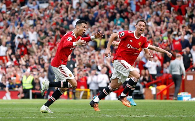 Cristiano Ronaldo celebrates scoring Manchester United's third goal with Nemanja Matic in the Premier League match against Norwich City, at Old Trafford, Manchester, on Saturday. 