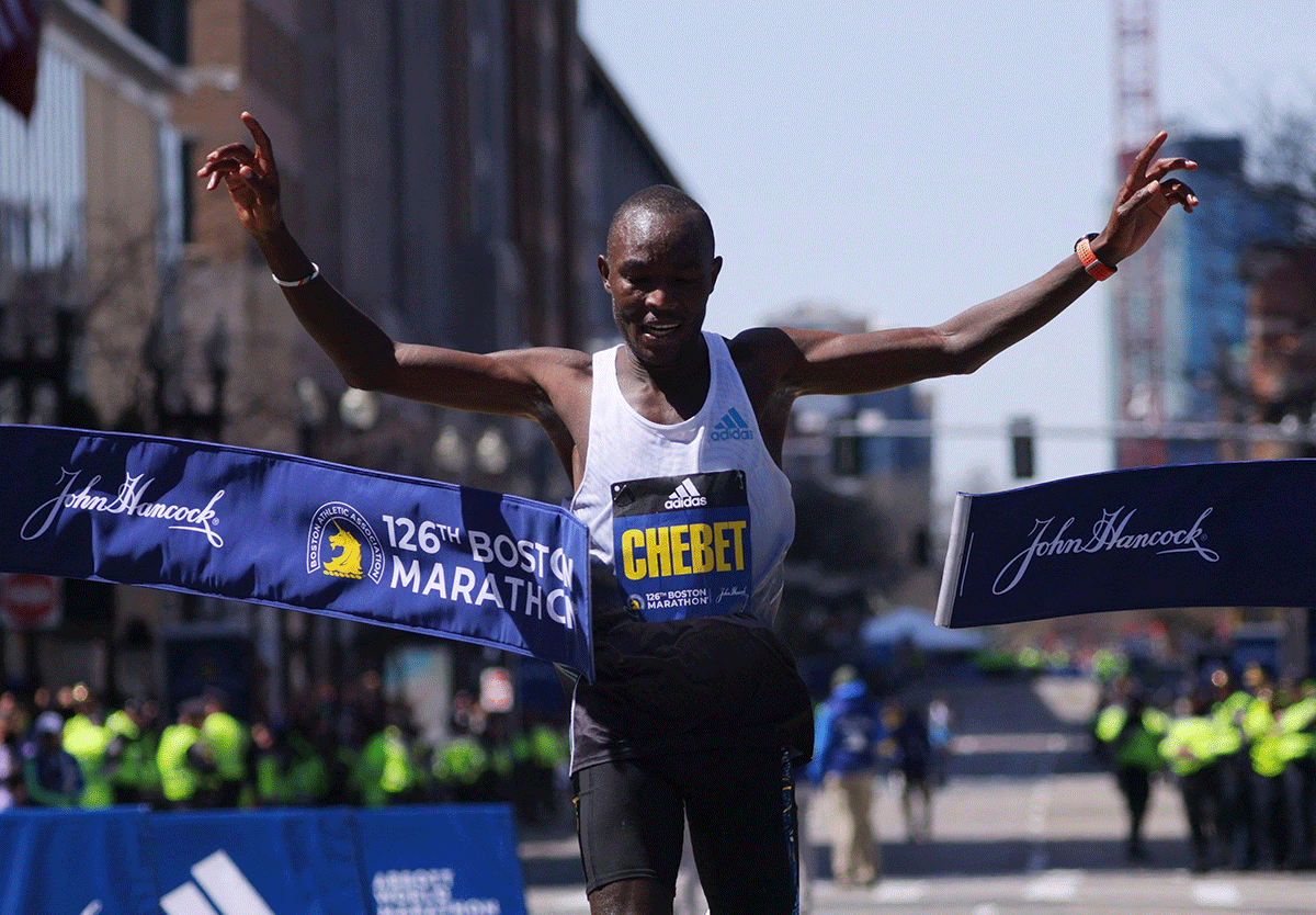 Kenya's Evans Chebet celebrates on crossing the finish line 