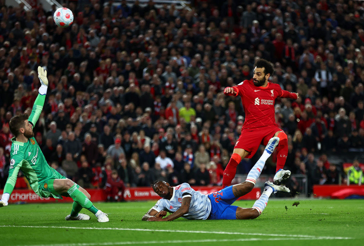 Mohamed Salah scores Liverpool's fourth goal whilst under pressure from Aaron Wan-Bissaka