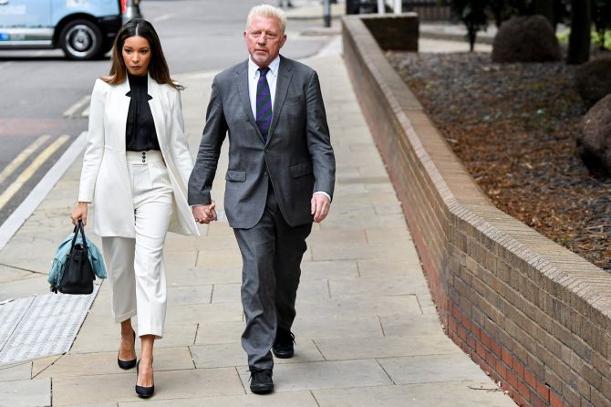 Boris Becker arrives with his partner Lilian de Carvalho Monteiro at Southwark Crown Court to face sentencing after being found guilty of four charges earlier this month, in London, Britain, on Friday.