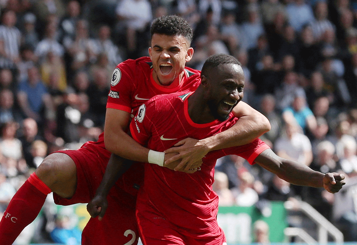 Liverpool's Naby Keita celebrates with Luis Diaz and Andrew Robertson after scoring their first goal against Newcastle at St James' Park, Newcastle 
