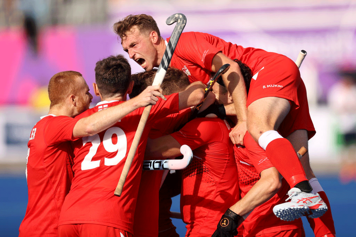 England's Nicholas Bandurak  celebrates with teammates after scoring the equaliser in the Men's Hockey - Pool B match against India at University of Birmingham Hockey & Squash Centre, during the Commonwealth Games on Monday 