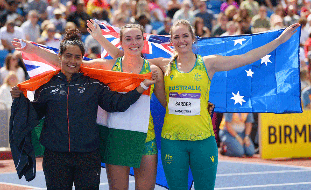 (L-R) Bronze medalist, India's Annu Rani, Australia's Silver medalist Mackenzie Little and Australia's gold medalist Kelsey-Lee Barber celebrate following the Women's Javelin Throw final on day ten of the Birmingham 2022 Commonwealth Games at Alexander Stadium in Birmingham on Sunday